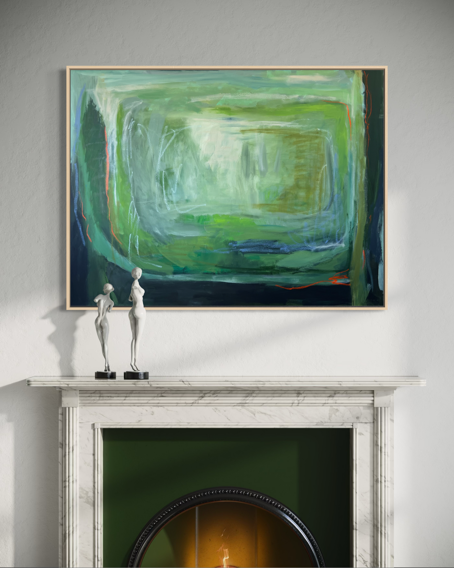 Abstract painting above a fireplace with decorative sculptures on a mantelpiece.