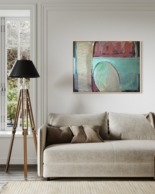 Living room with a beige sofa, abstract painting, and tripod lamp.