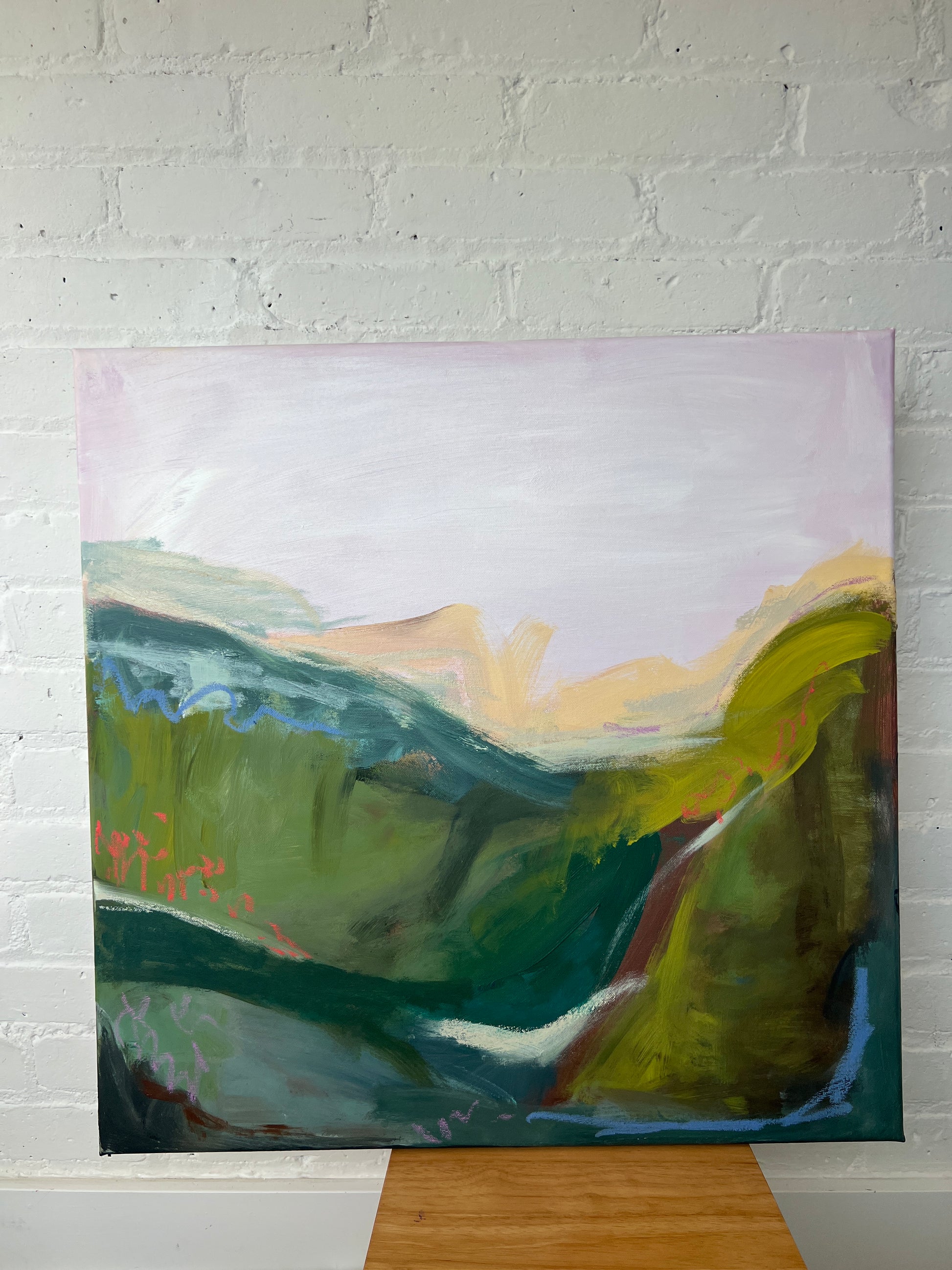 Abstract painting on a textured white wall